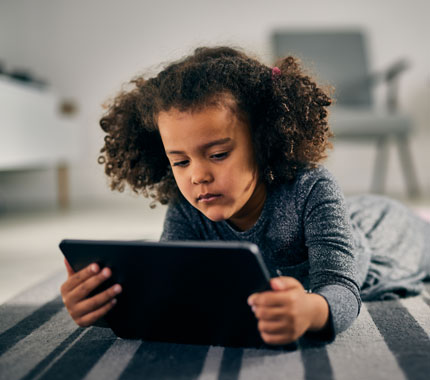 young girl on a tablet